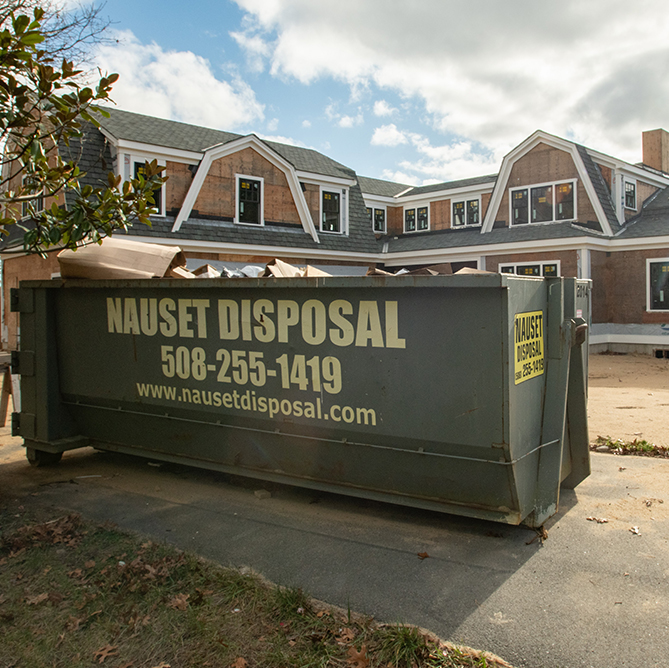 nauset disposal dumpster in front of house